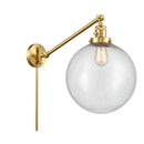 Beacon Swing Arm shown in the Satin Gold finish with a Seedy shade