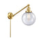 Beacon Swing Arm shown in the Satin Gold finish with a Seedy shade