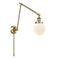 Beacon Swing Arm shown in the Antique Brass finish with a Matte White shade