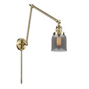 Bell Swing Arm shown in the Antique Brass finish with a Plated Smoke shade