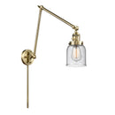 Bell Swing Arm shown in the Antique Brass finish with a Seedy shade