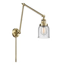 Bell Swing Arm shown in the Antique Brass finish with a Seedy shade