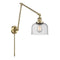 Bell Swing Arm shown in the Antique Brass finish with a Seedy shade