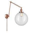 Beacon Swing Arm shown in the Antique Copper finish with a Clear shade