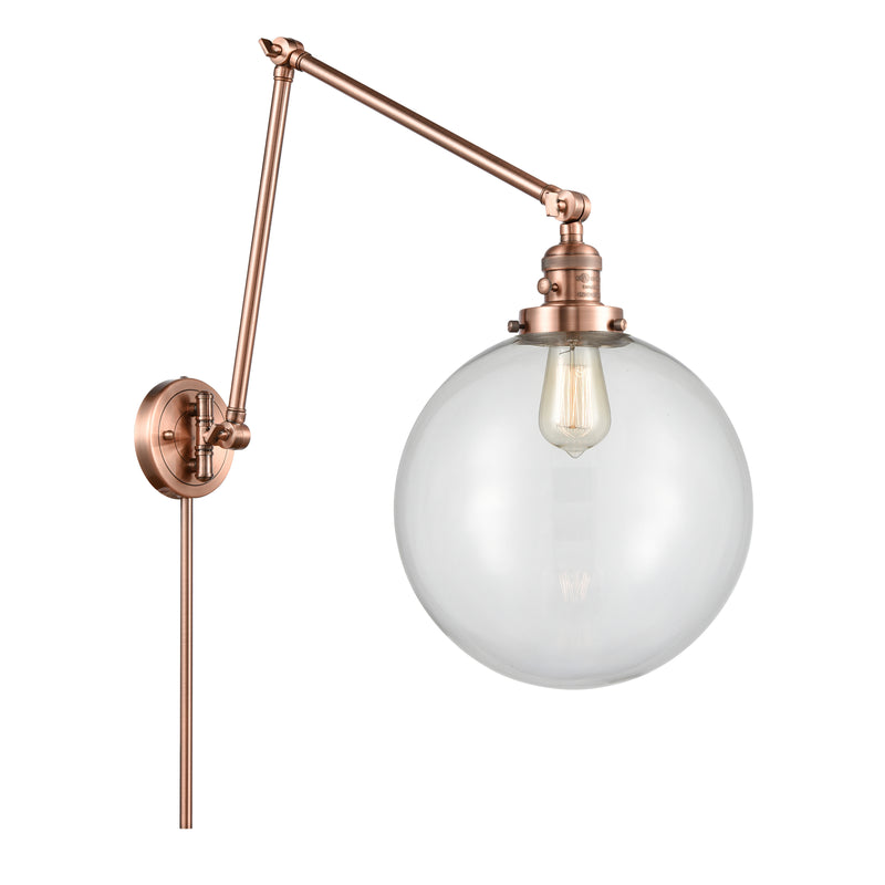 Beacon Swing Arm shown in the Antique Copper finish with a Clear shade