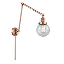 Beacon Swing Arm shown in the Antique Copper finish with a Seedy shade