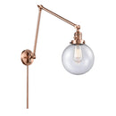 Beacon Swing Arm shown in the Antique Copper finish with a Seedy shade