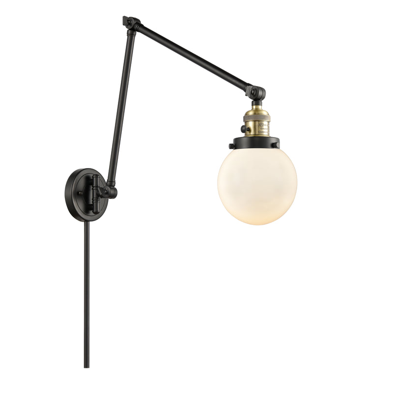 Beacon Swing Arm shown in the Black Antique Brass finish with a Matte White shade