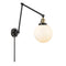 Beacon Swing Arm shown in the Black Antique Brass finish with a Matte White shade