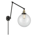 Beacon Swing Arm shown in the Black Antique Brass finish with a Clear shade