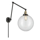 Beacon Swing Arm shown in the Black Antique Brass finish with a Clear shade