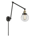 Beacon Swing Arm shown in the Black Antique Brass finish with a Clear shade