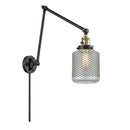 Stanton Swing Arm shown in the Black Antique Brass finish with a Clear Wire Mesh shade