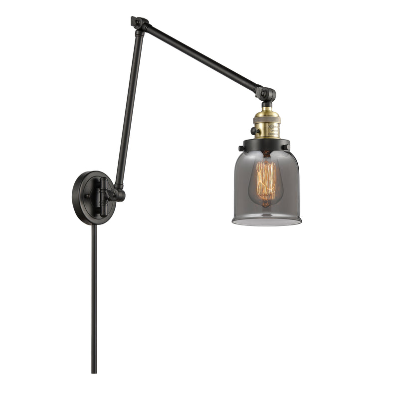 Bell Swing Arm shown in the Black Antique Brass finish with a Plated Smoke shade