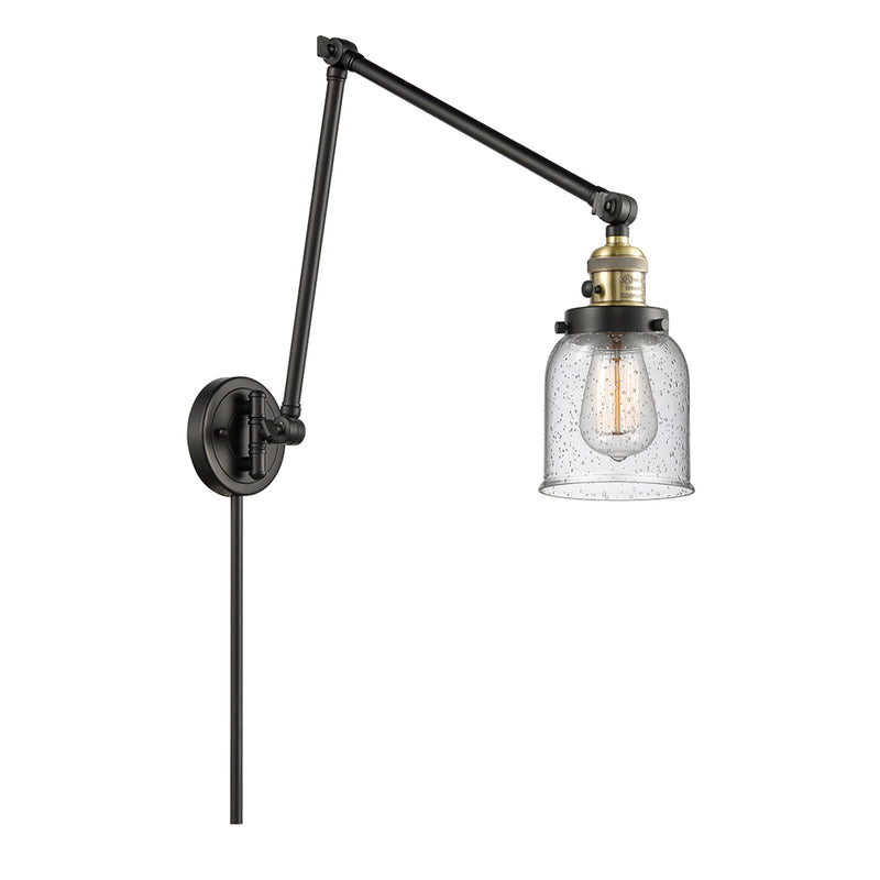 Bell Swing Arm shown in the Black Antique Brass finish with a Seedy shade