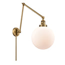 Beacon Swing Arm shown in the Brushed Brass finish with a Matte White shade