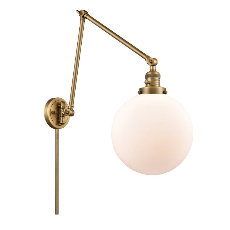 Beacon Swing Arm shown in the Brushed Brass finish with a Matte White shade