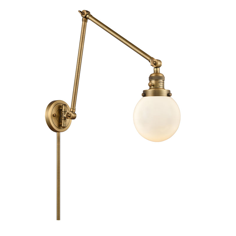 Beacon Swing Arm shown in the Brushed Brass finish with a Matte White shade