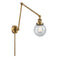 Beacon Swing Arm shown in the Brushed Brass finish with a Seedy shade