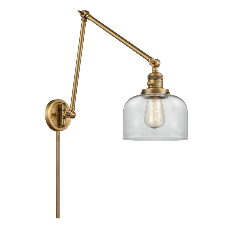 Bell Swing Arm shown in the Brushed Brass finish with a Clear shade