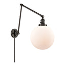 Beacon Swing Arm shown in the Oil Rubbed Bronze finish with a Matte White shade