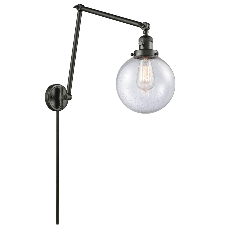 Beacon Swing Arm shown in the Oil Rubbed Bronze finish with a Seedy shade