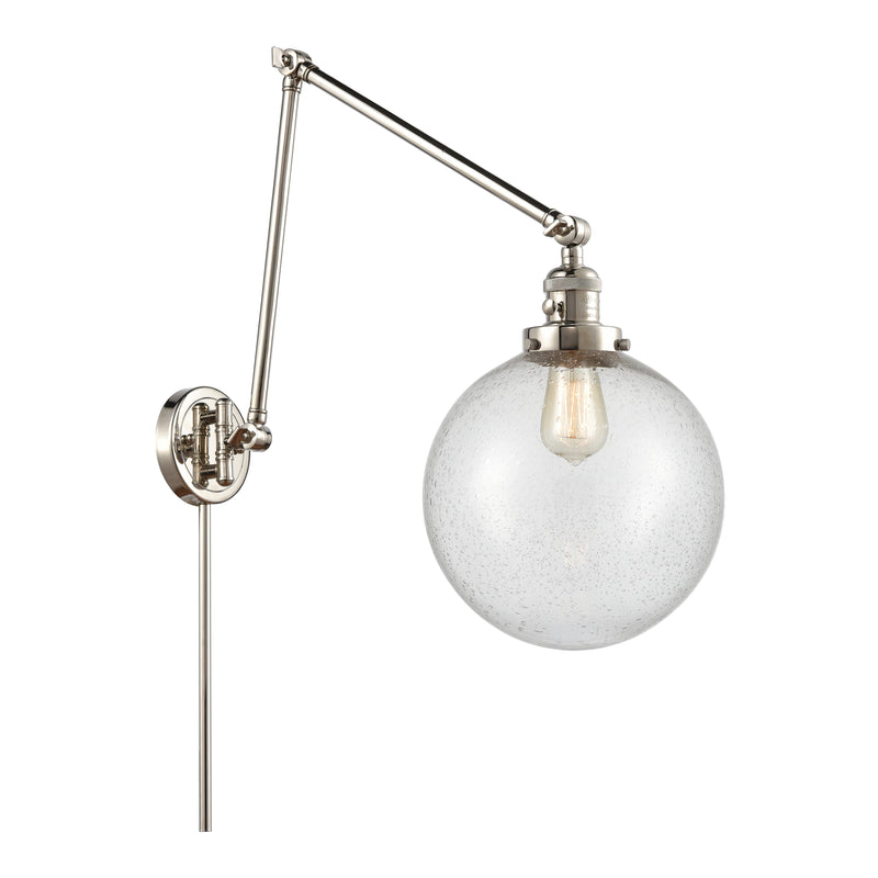 Beacon Swing Arm shown in the Polished Nickel finish with a Seedy shade