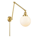 Beacon Swing Arm shown in the Satin Gold finish with a Matte White shade