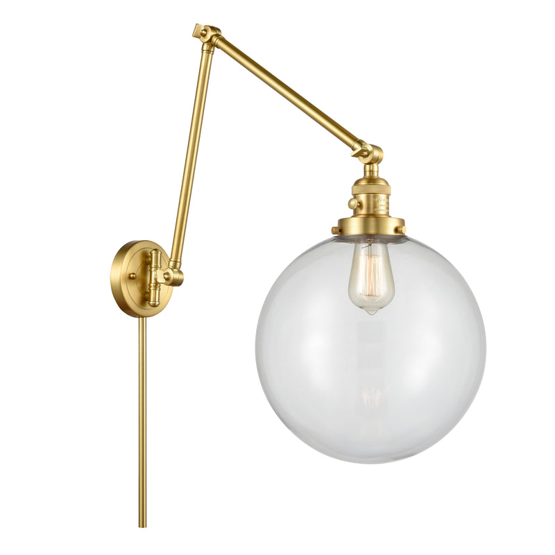 Beacon Swing Arm shown in the Satin Gold finish with a Clear shade