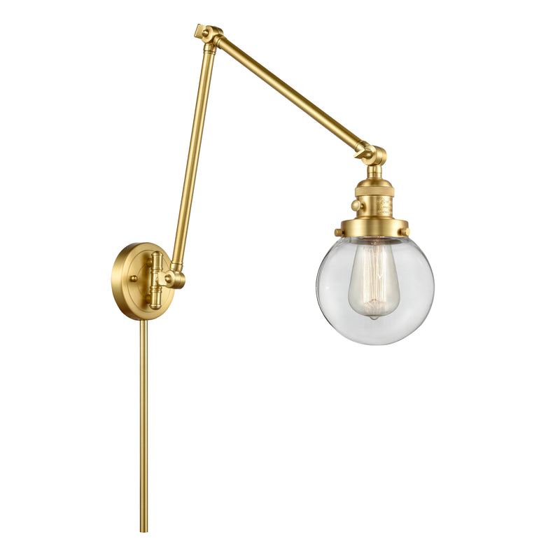 Beacon Swing Arm shown in the Satin Gold finish with a Clear shade