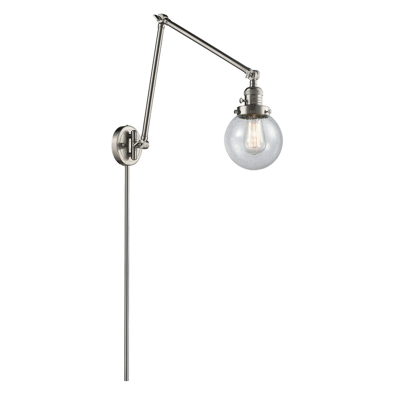 Beacon Swing Arm shown in the Brushed Satin Nickel finish with a Seedy shade