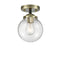 Beacon Semi-Flush Mount shown in the Black Antique Brass finish with a Clear shade