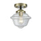 Oxford Semi-Flush Mount shown in the Black Antique Brass finish with a Clear shade