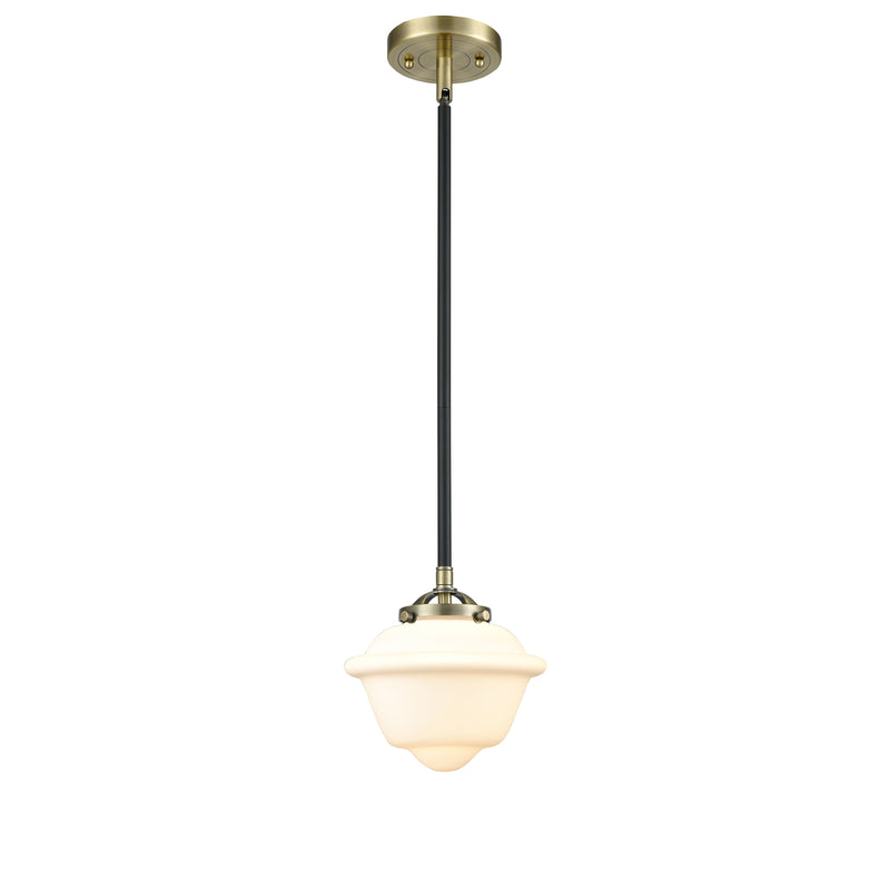 Oxford Mini Pendant shown in the Black Antique Brass finish with a Matte White shade