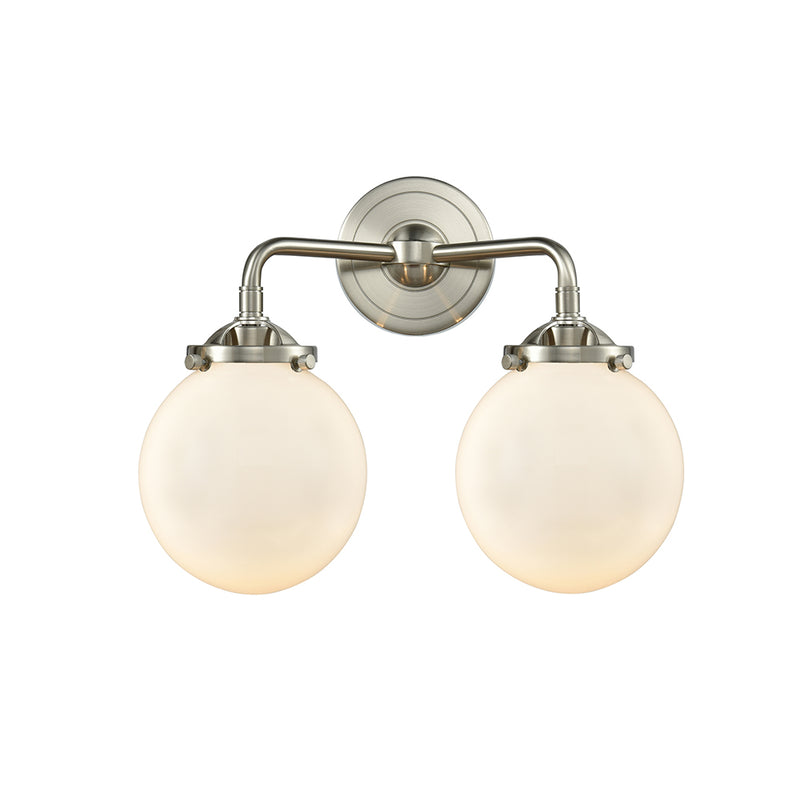 Beacon Bath Vanity Light shown in the Brushed Satin Nickel finish with a Matte White shade