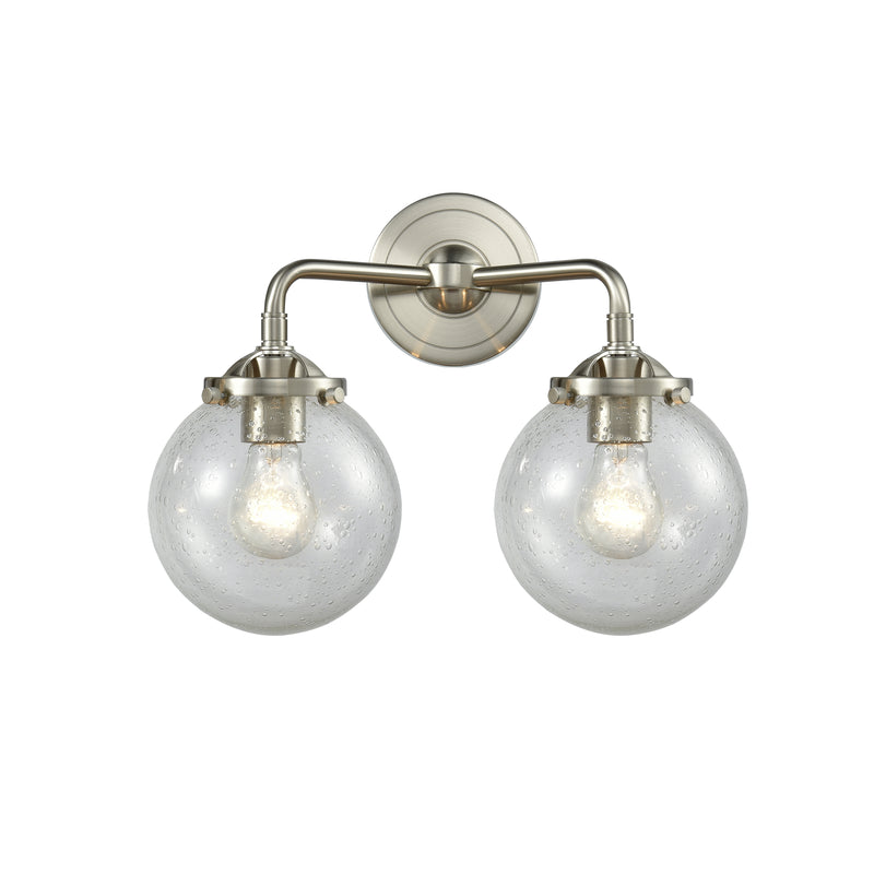 Beacon Bath Vanity Light shown in the Brushed Satin Nickel finish with a Seedy shade