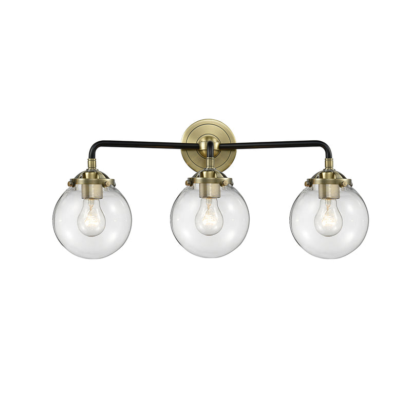 Beacon Bath Vanity Light shown in the Black Antique Brass finish with a Clear shade