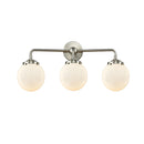 Beacon Bath Vanity Light shown in the Brushed Satin Nickel finish with a Matte White shade