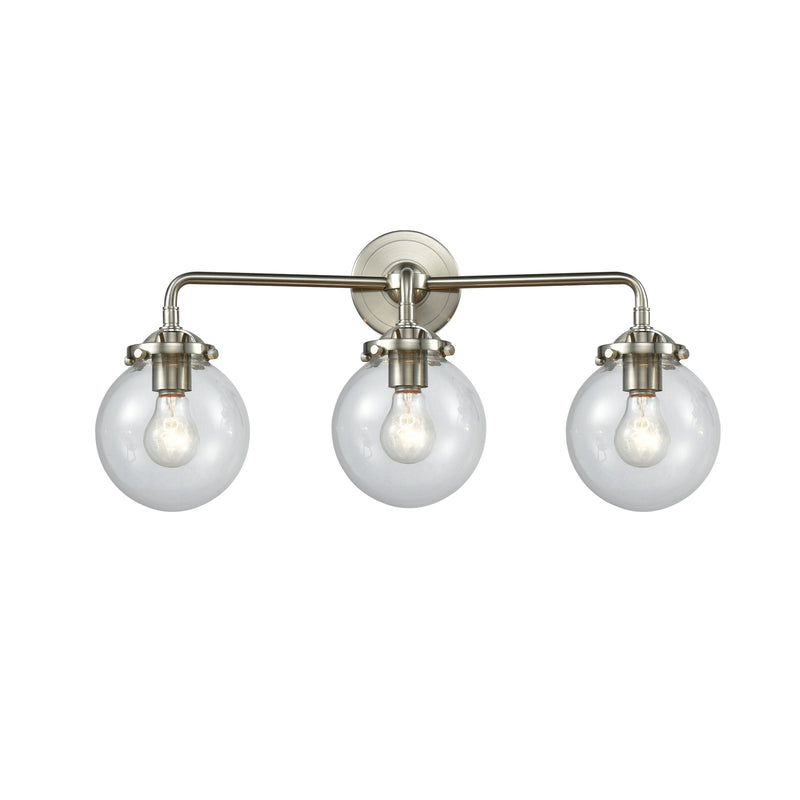 Beacon Bath Vanity Light shown in the Brushed Satin Nickel finish with a Clear shade