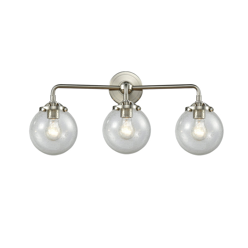 Beacon Bath Vanity Light shown in the Brushed Satin Nickel finish with a Seedy shade