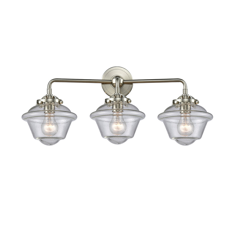 Oxford Bath Vanity Light shown in the Brushed Satin Nickel finish with a Seedy shade