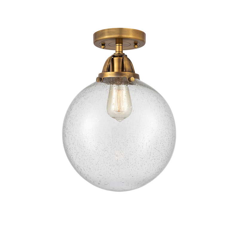 Beacon Semi-Flush Mount shown in the Brushed Brass finish with a Seedy shade