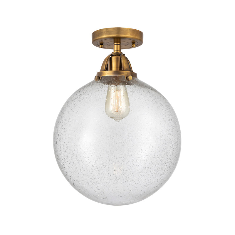 Beacon Semi-Flush Mount shown in the Brushed Brass finish with a Seedy shade