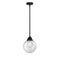 Beacon Mini Pendant shown in the Matte Black finish with a Seedy shade