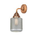 Stanton Sconce shown in the Antique Copper finish with a Clear Wire Mesh shade