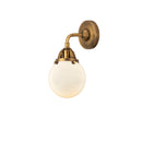 Beacon Sconce shown in the Brushed Brass finish with a Matte White shade