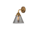 Cone Sconce shown in the Brushed Brass finish with a Plated Smoke shade