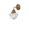 Oxford Sconce shown in the Brushed Brass finish with a Clear shade