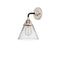 Cone Sconce shown in the Black Polished Nickel finish with a Clear shade