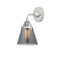 Cone Sconce shown in the Polished Chrome finish with a Plated Smoke shade